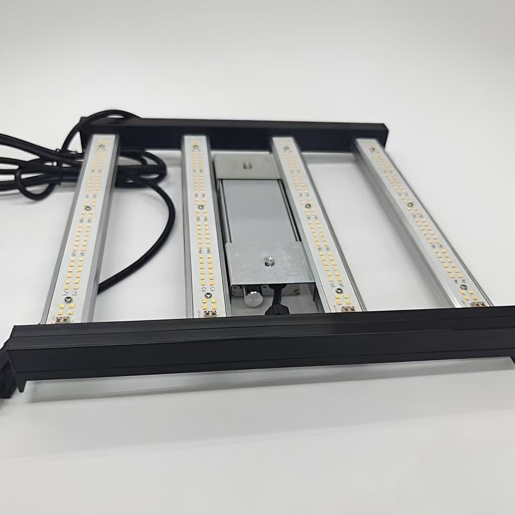 Fine spectrum of led lights covering silver reflective bar with black frame and a black cord